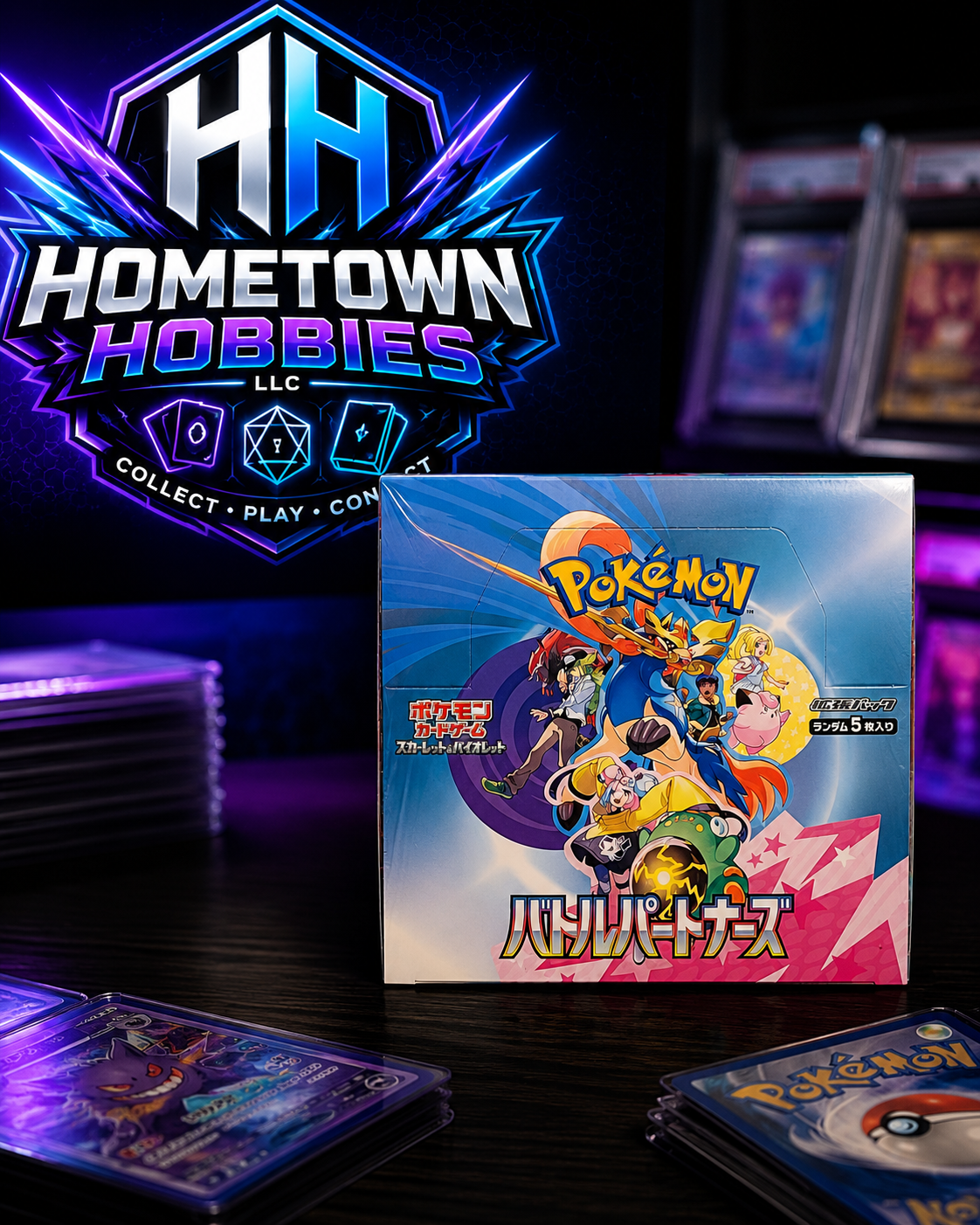 A boxed Pokémon TCG booster pack displayed on a dark tabletop, with several cards fanned out in front and a large Hometown Hobbies LLC logo graphic behind it.