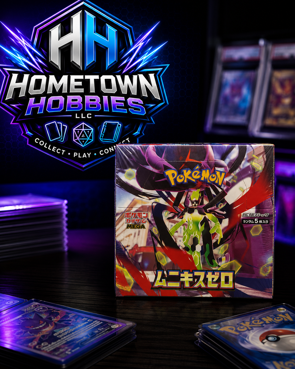 A boxed Pokémon MEGA Mini-Card Set box is displayed on a dark table with stacks of trading cards around it and a large Hometown Hobbies LLC logo in the background.