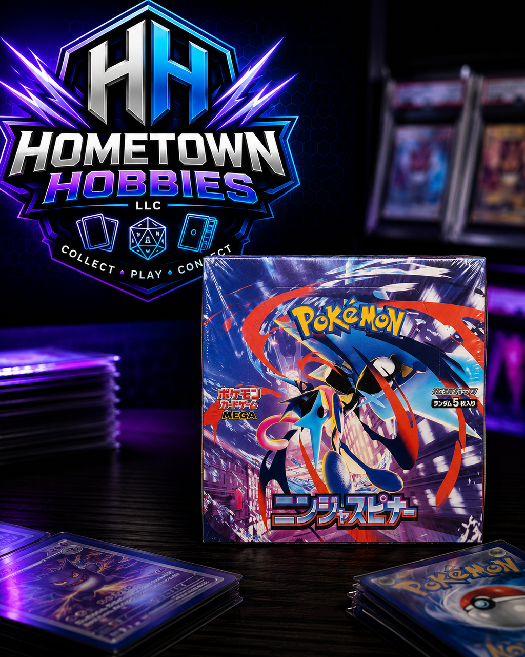 A sealed Pokémon TCG booster pack box stands on a dark tabletop, surrounded by cards in sleeves and a large Hometown Hobbies LLC logo in the background. The packaging artwork shows a stylized character with blue, red, and purple effects against a dark illustrated city scene.