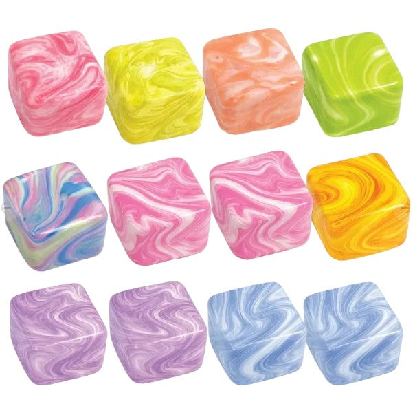 Twelve marbled square dice or candy-like cubes arranged in a 3-by-4 grid on a white background, showing many color combinations including pink, yellow, orange, green, blue, purple, and white swirls.