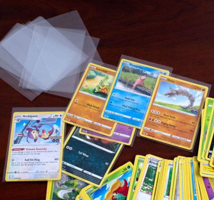 Pile of Pokemon cards ready to go into their protective sleeves.