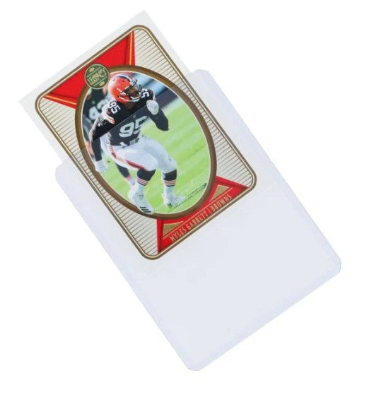 Picture of a football card being put into a toploader for protection.