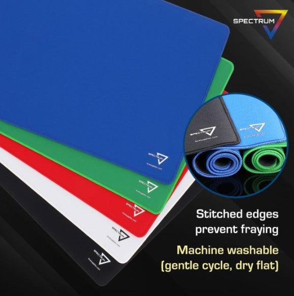 Colorful cutting mats with Spectrum brand logo on a black background