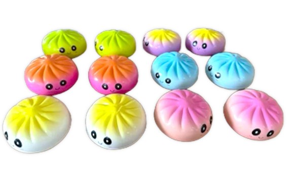 A set of ten cute, bun-shaped squishy toys with smiling faces, shown in various pastel and bright gradient colors on a plain white background.